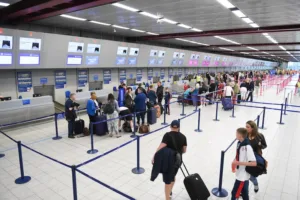 People queuing in the airport check-in area